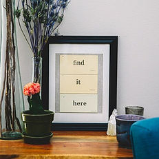 picture on side table that says "find it here"