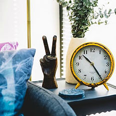 gold clock on side table