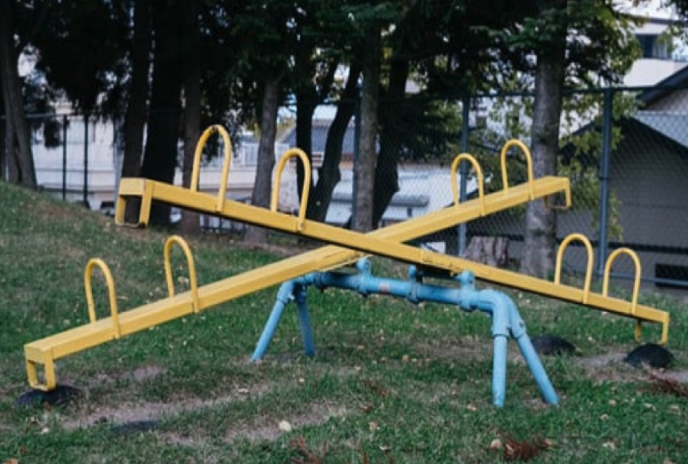 Set of yellow tetter totters in park